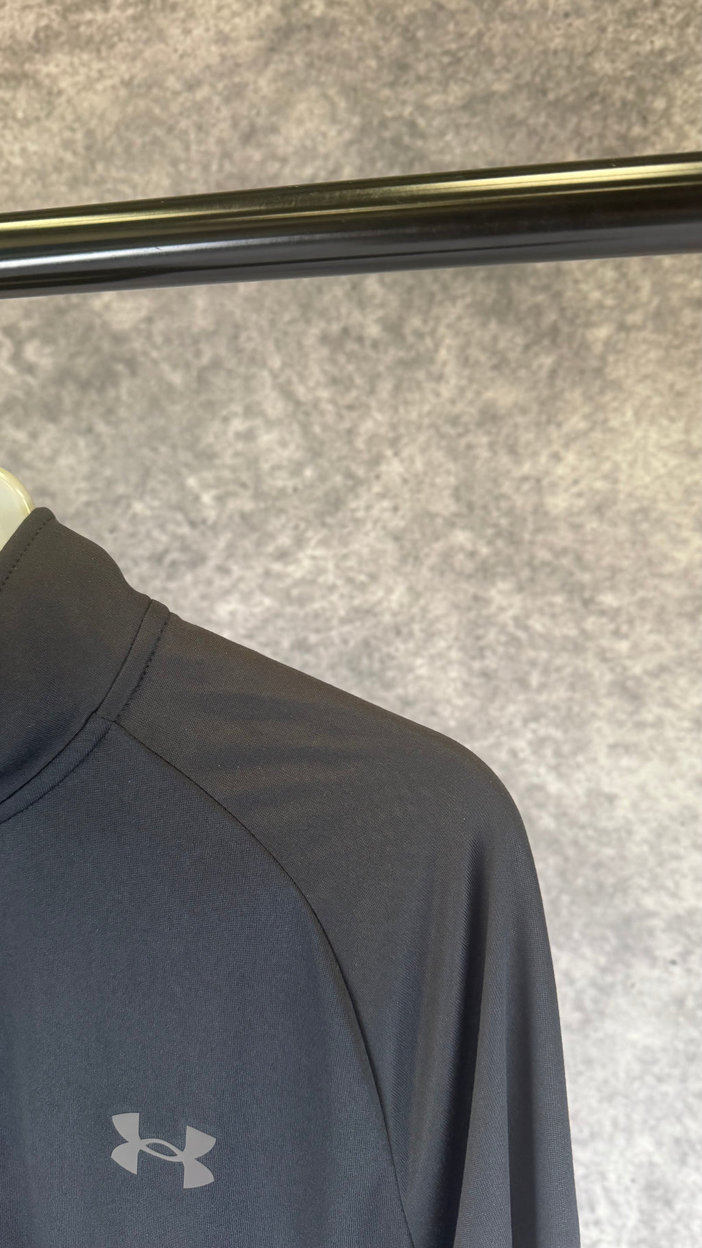 Under Armour black tech 2.0 1/2 zip.
