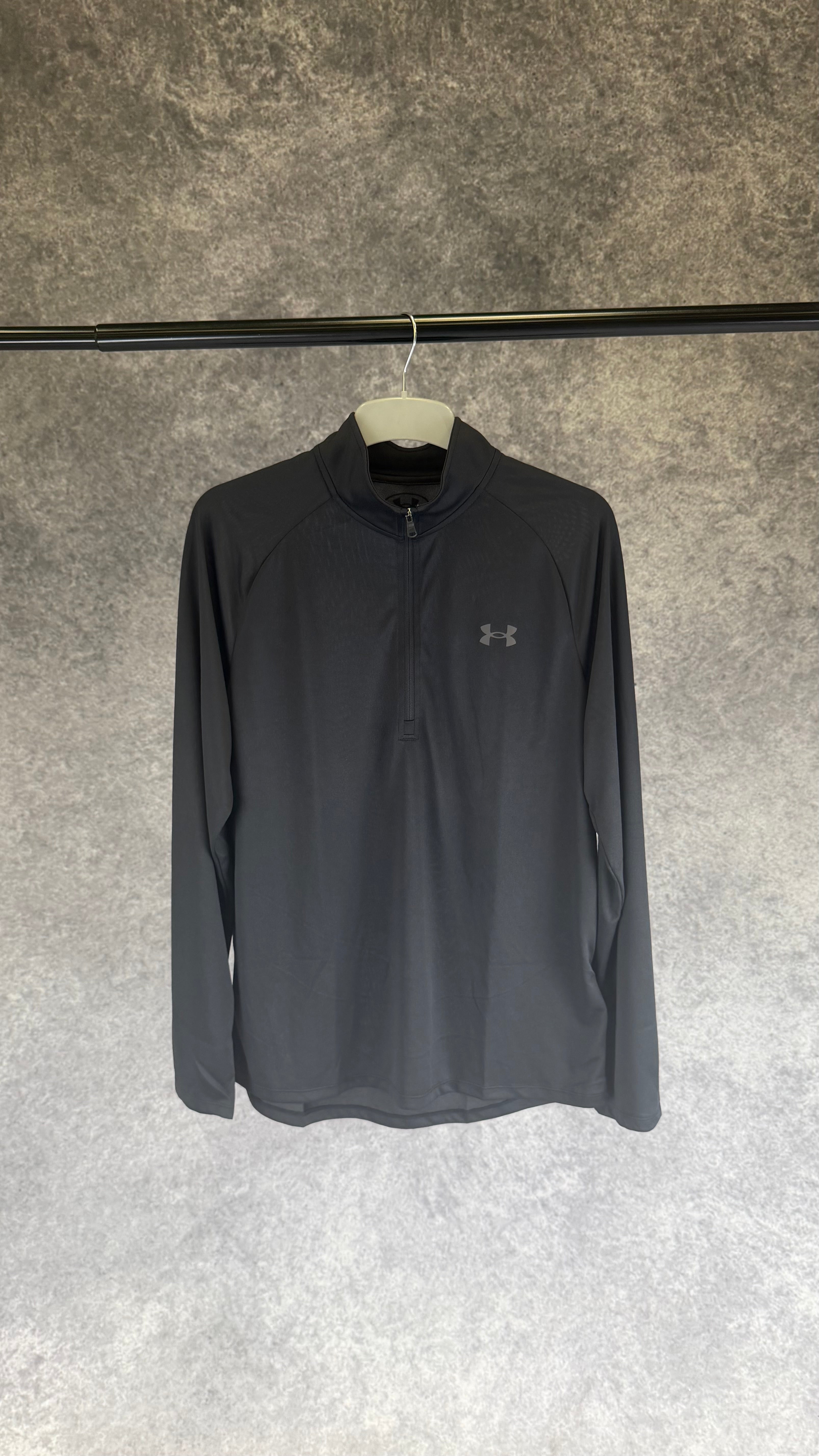 Under Armour black tech 2.0 1/2 zip.