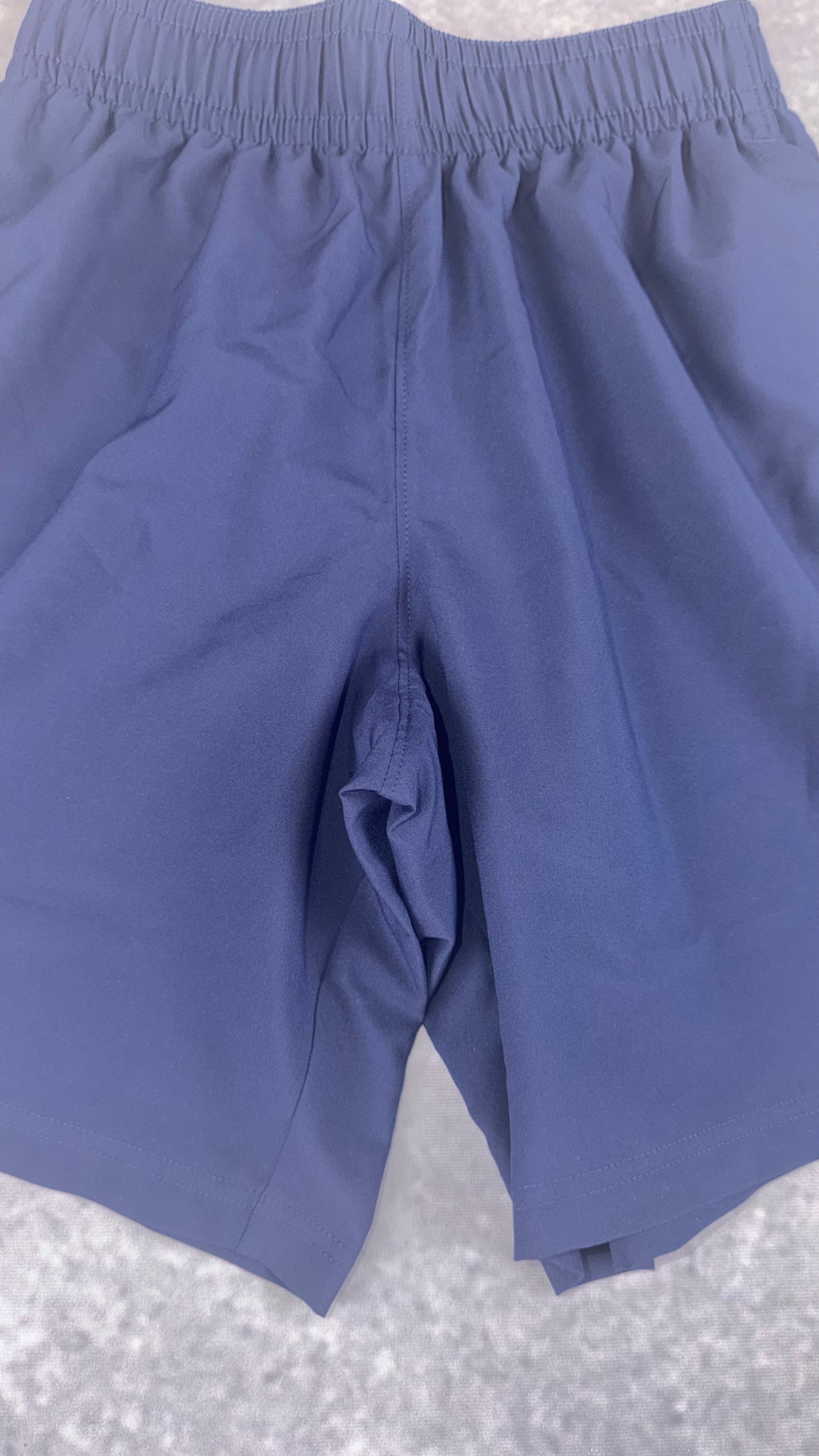 Retail £25 Under Armour tech woven word mark navy shorts.