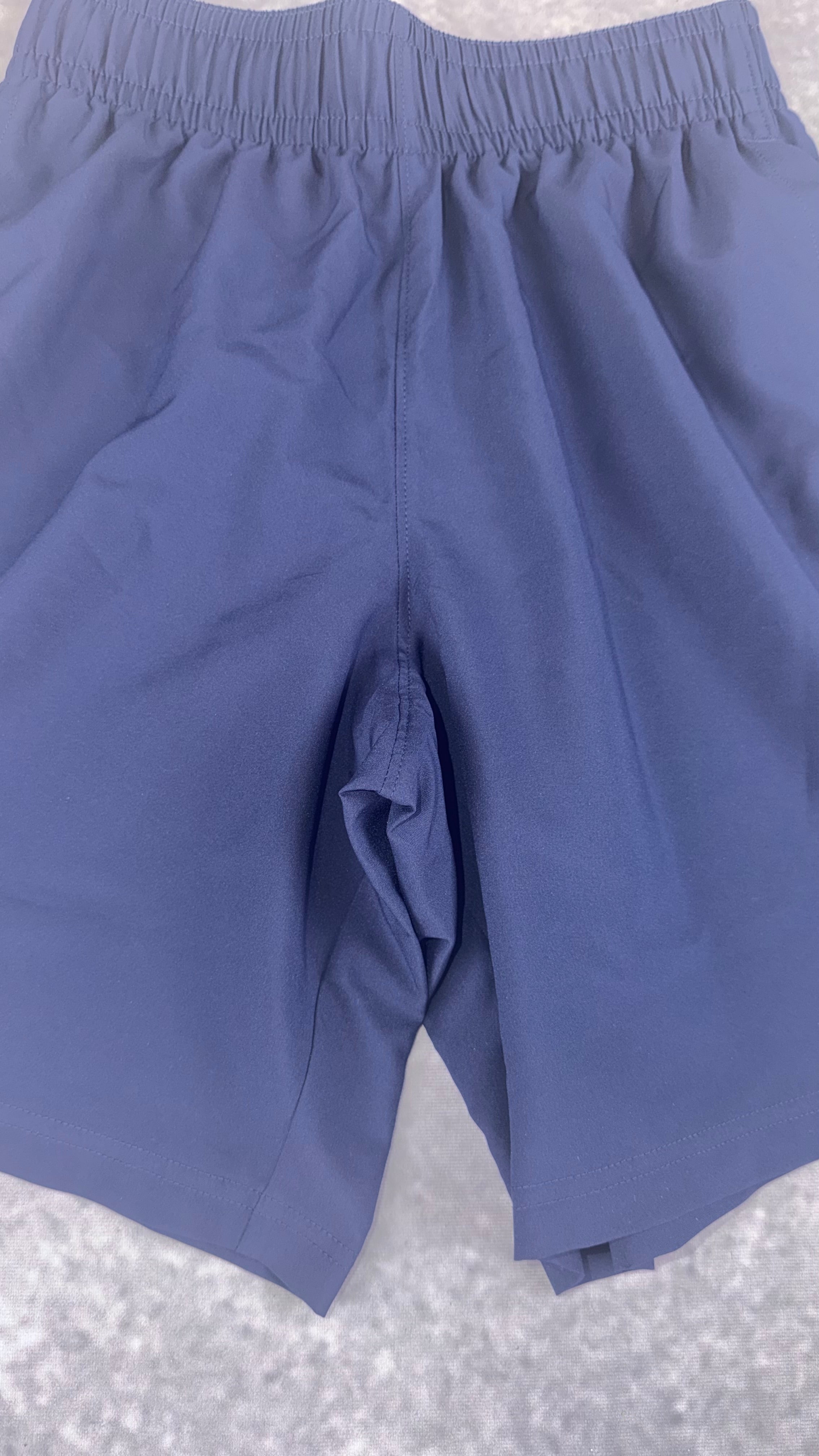 Retail £25 Under Armour tech woven word mark navy shorts.