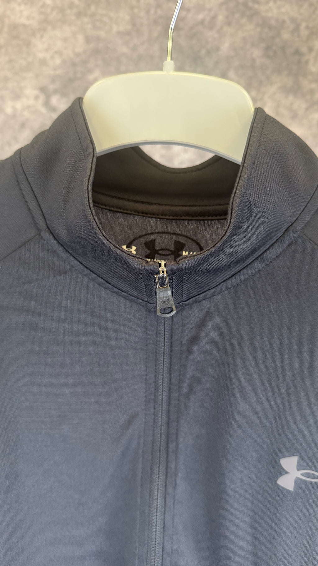 Under Armour black tech 2.0 1/2 zip.