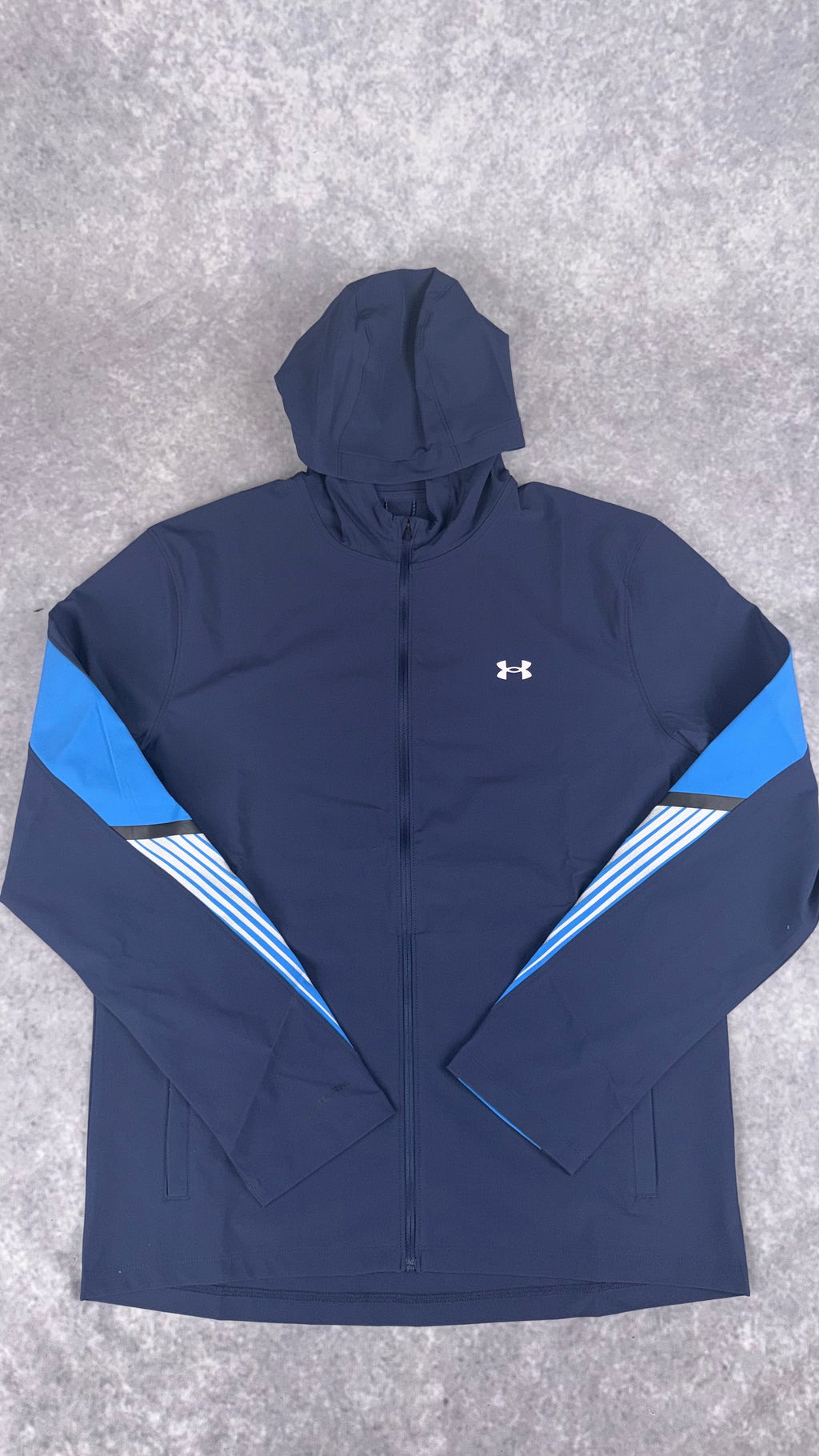 Under armour navy velociti storm hooded jacket.