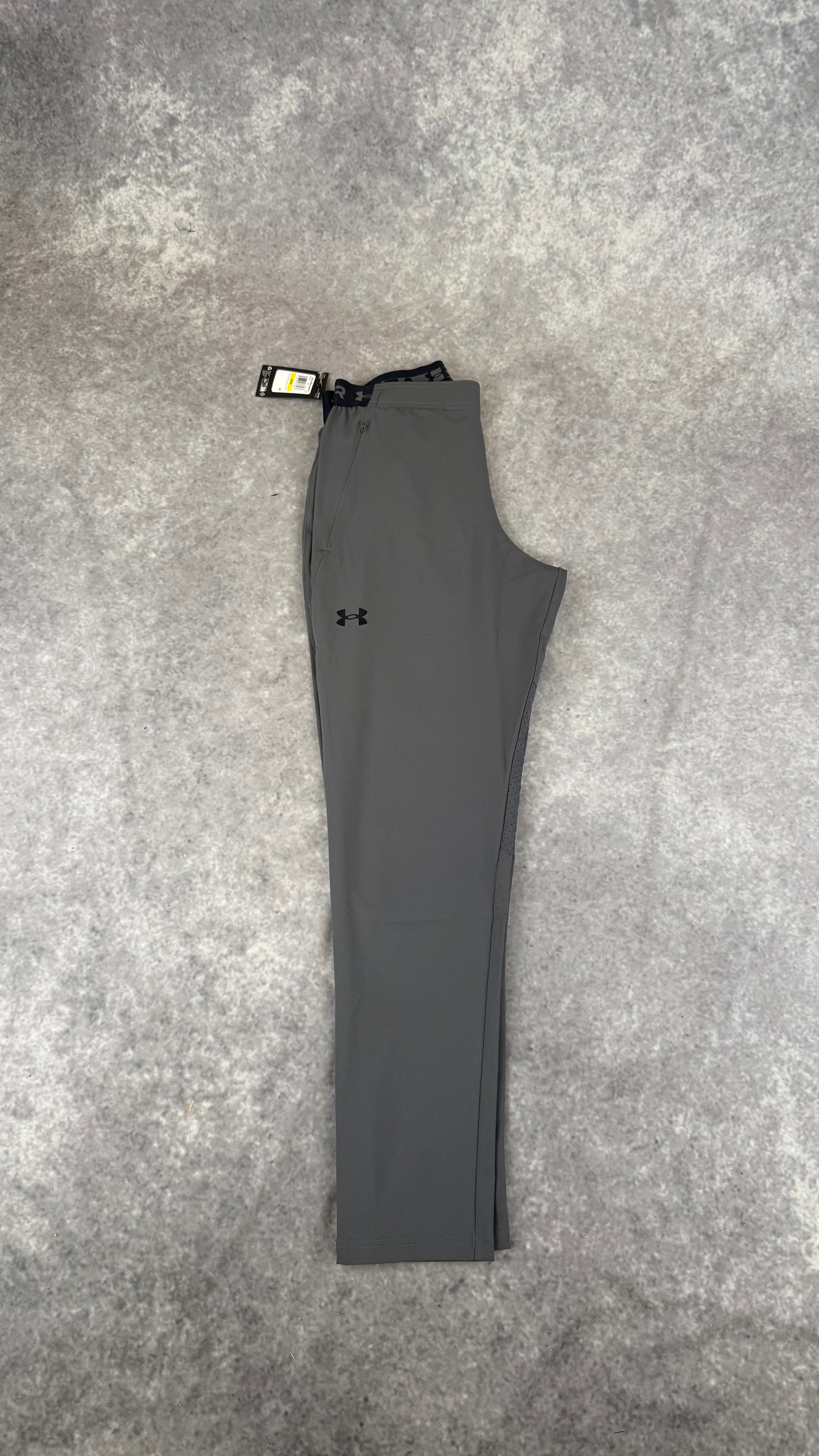 Under armour grey vanish woven tapered pants.