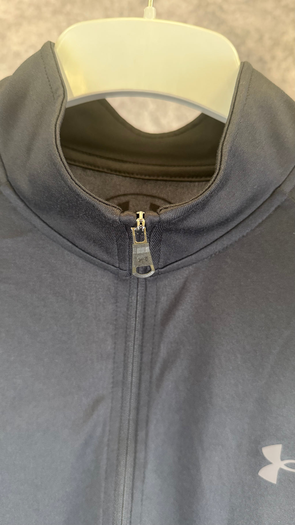 Under Armour black tech 2.0 1/2 zip.