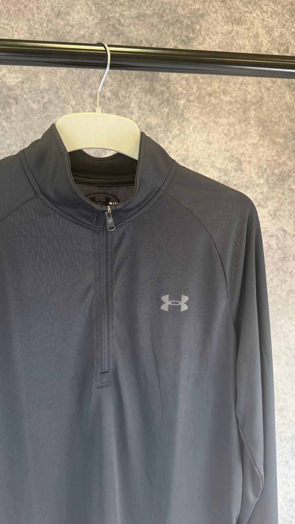 Under Armour black tech 2.0 1/2 zip.