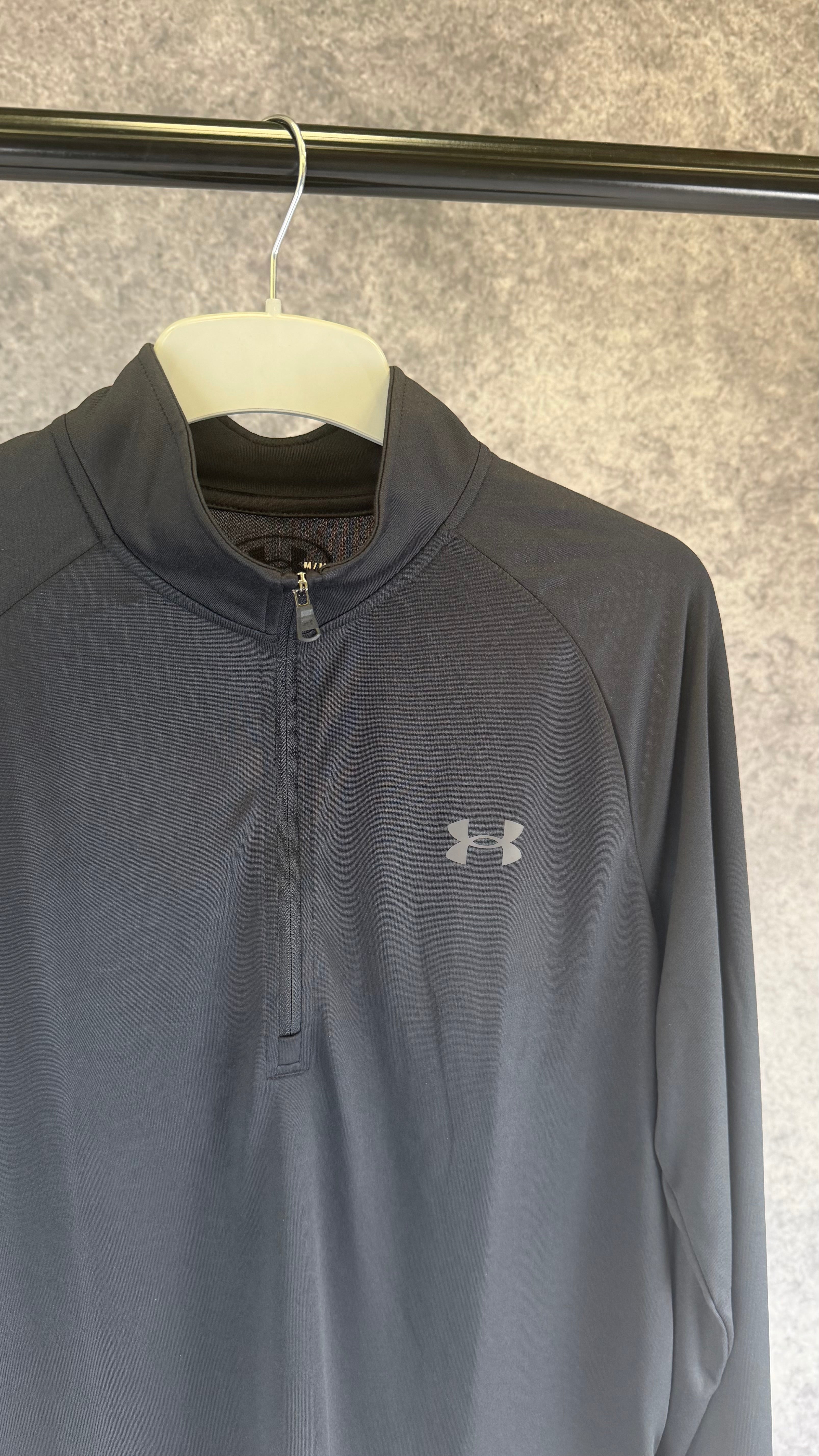 Under Armour black tech 2.0 1/2 zip.